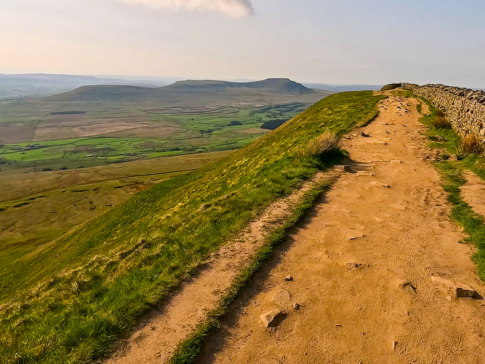 Heading along the top of Whernside with Ingleborough in the distance