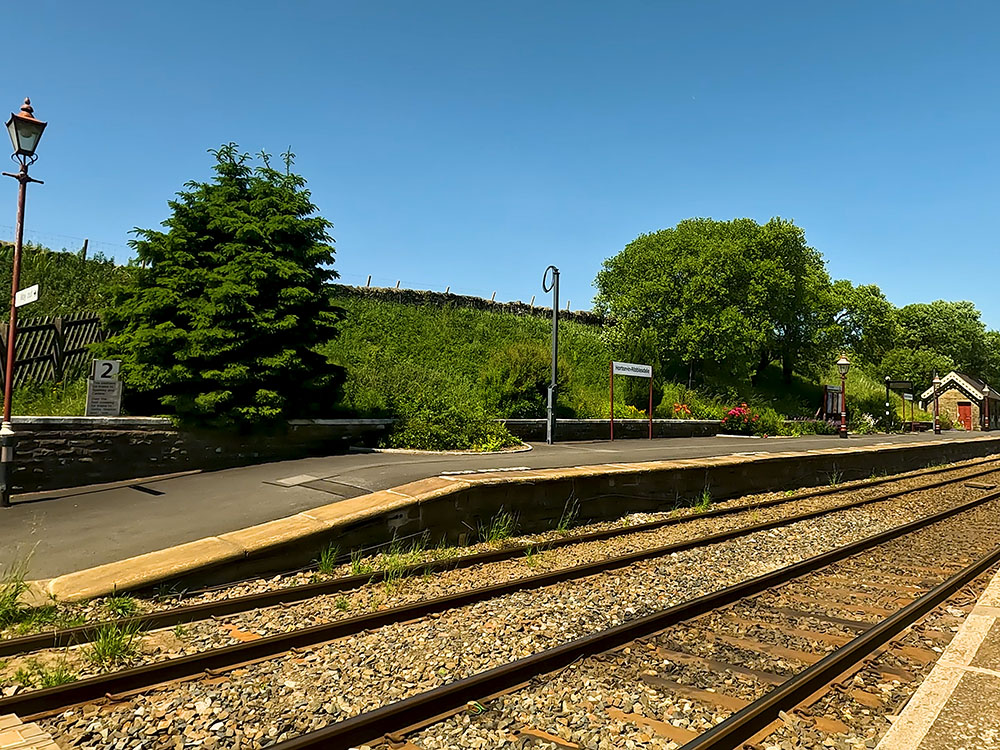 The path crossing the railway line at Horton in Ribblesdale station