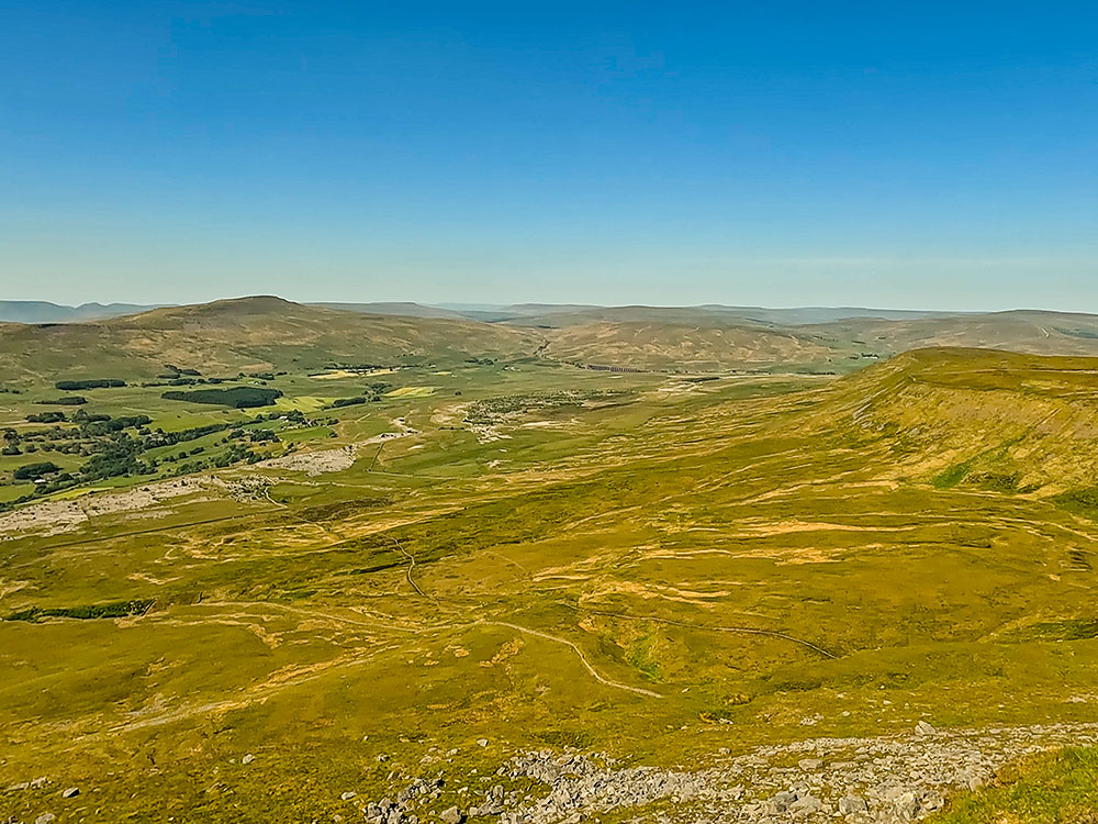 View from Ingleborough looking towards Whernside, the Howgills, Ribblehead Viaduct and Simon Fell
