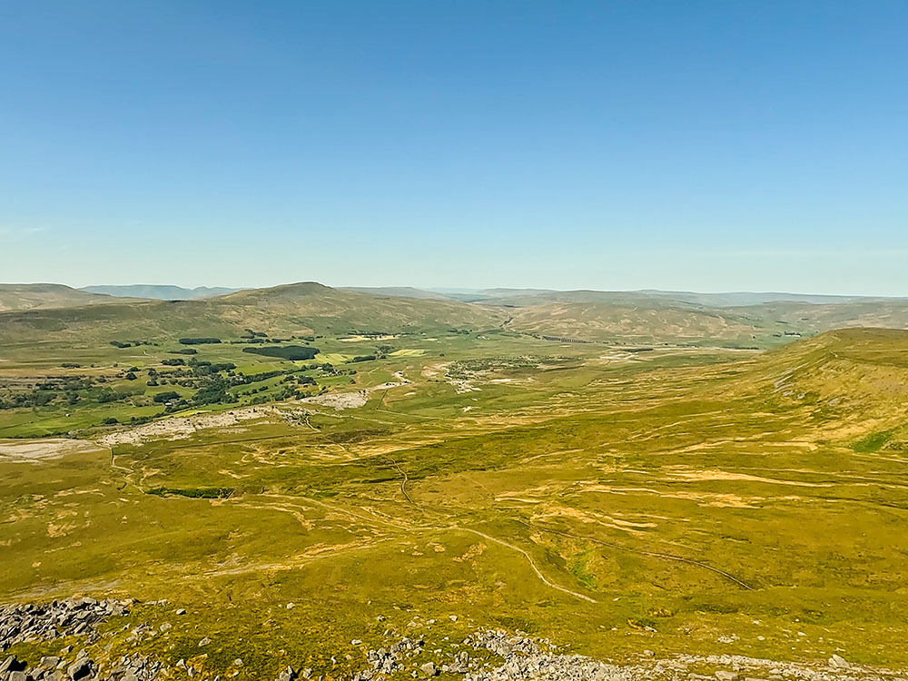 View of the Ribblehead Viaduct and Whernside from the summit edge of Ingleborough