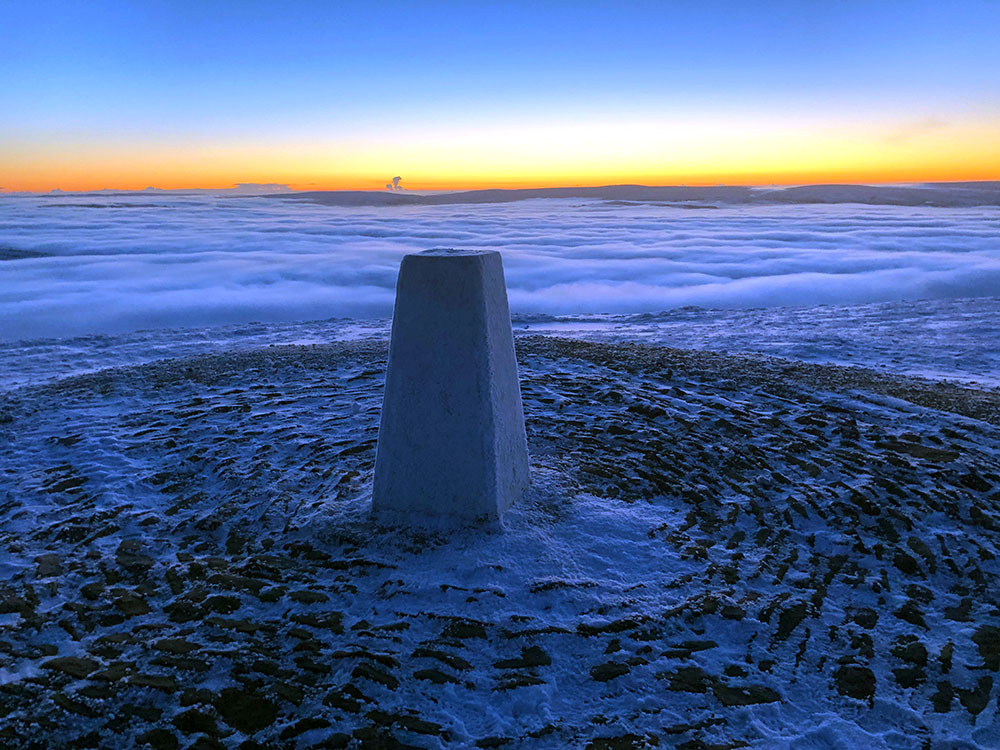Early morning on the summit of Pendle Hill with a cloud inversion