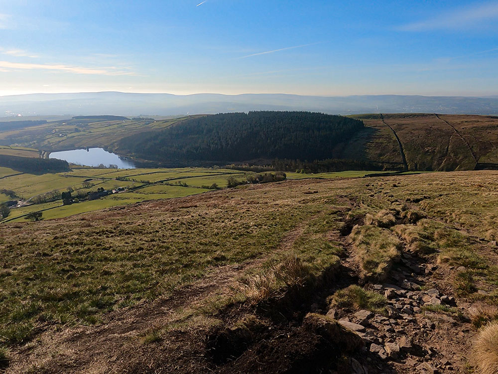 Heading down off Pendle Hill with Lower Ogden Reservoir and Fell Wood below