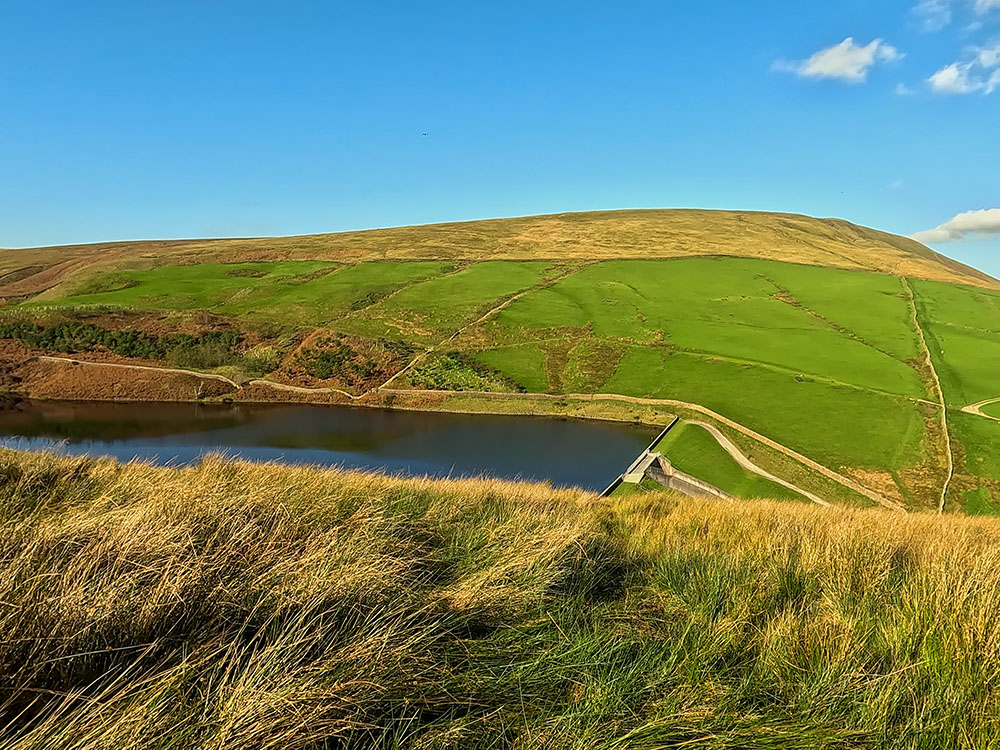 Heading down to Upper Ogden Reservoir with Pendle Hill ahead on the Pendle Witches Walk