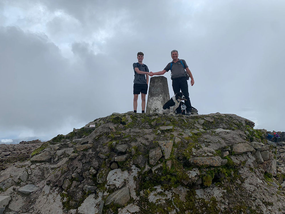 Dominic, Mick and Alfie by the Trig Point on Ben Nevis