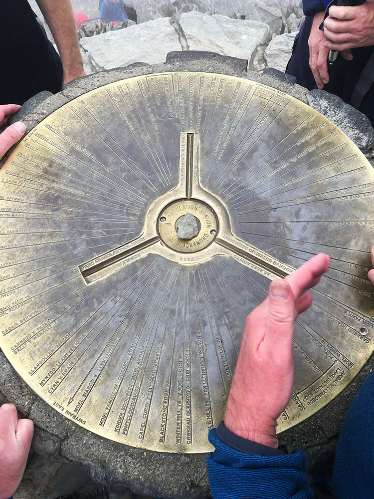 The elaborately designed brass mounting plate on top of the Snowdon Trig Point