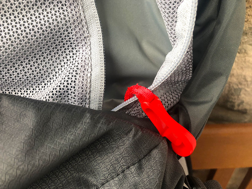 Safety clip inside zippered pocket