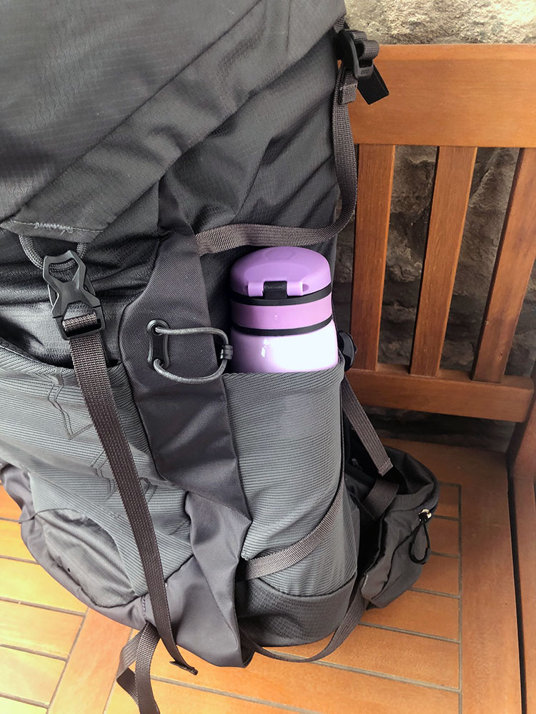 Side mesh pocket with water bottle in it