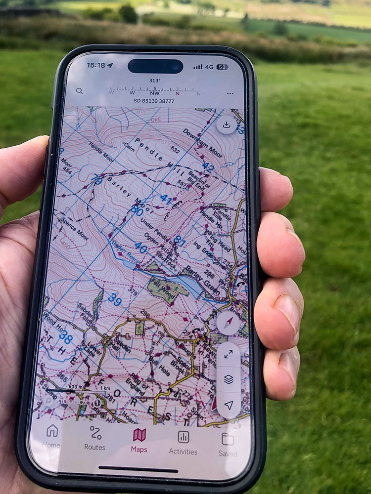 The compass bearing is shown at the top of the OS mapping app on an iPhone