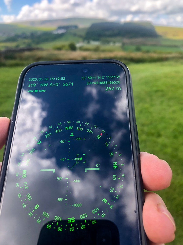 The more complex compass screen on the Spyglass app on an iPhone, pointing towards Pendle Hill