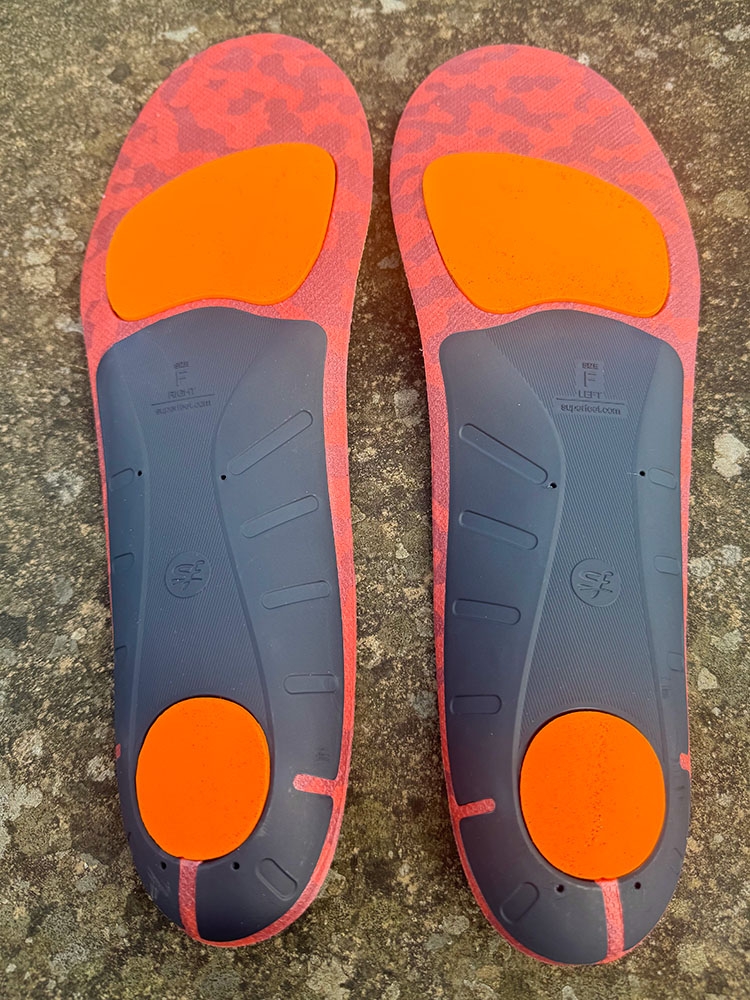 The grey on the insole is the Evolyte Carbon Fibre Stabiliser Cap that provides stability on a Superfeet insole
