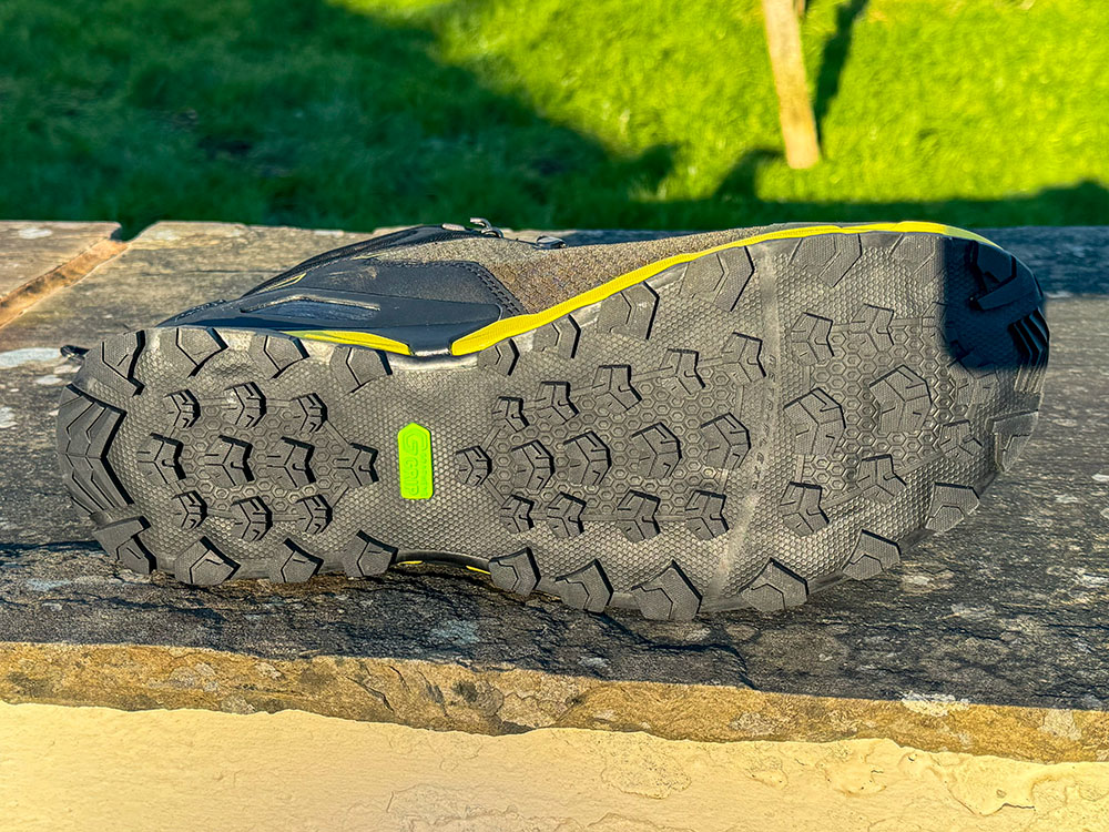 Lugs in different directions on different parts of the hiking boot sole