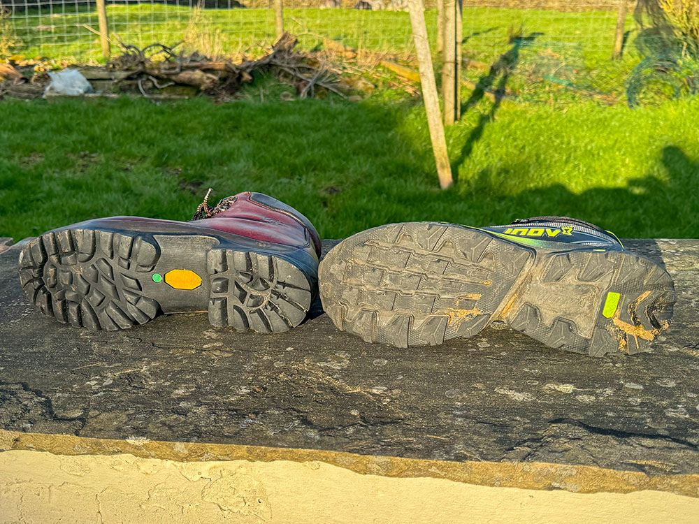 The sole on a stiff, rigid leather walking boot and the sole on a more flexible synthetic hiking boot