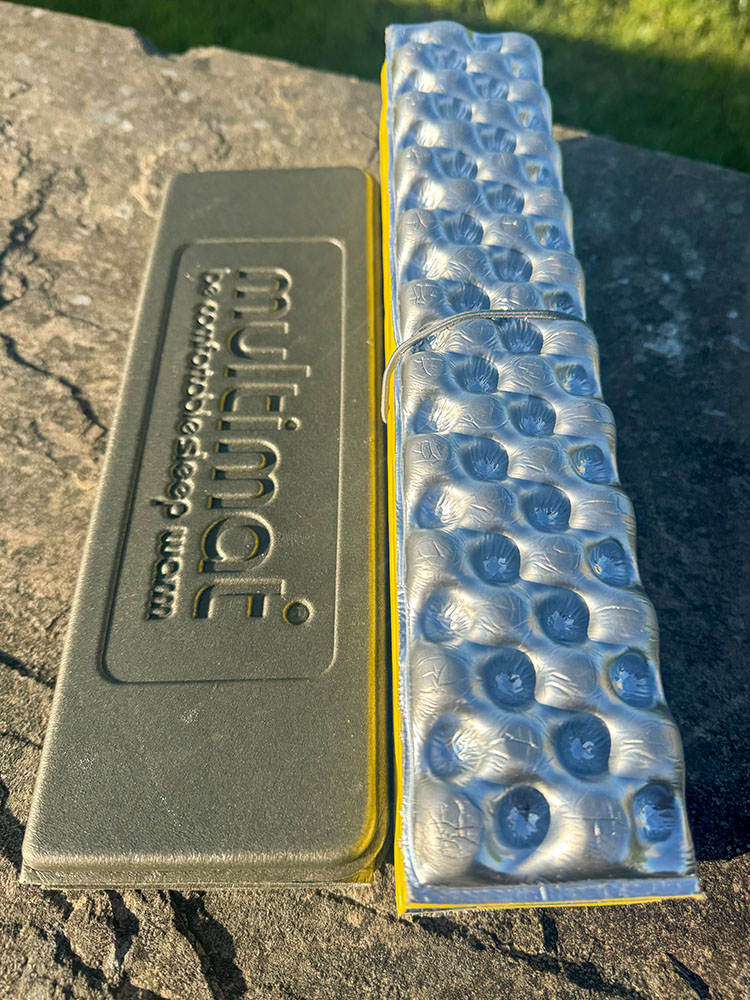 Folded Multimat and Therm-a-Rest Z Seat sit mats side by side showing their packed width.