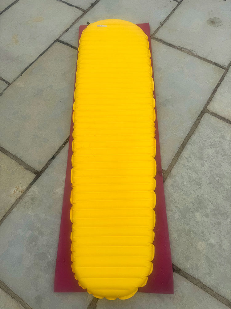 A closed foam mat under an air sleeping mat - it takes the R-value from 4 to 5.5, and provides protection from any sharp objects on the ground