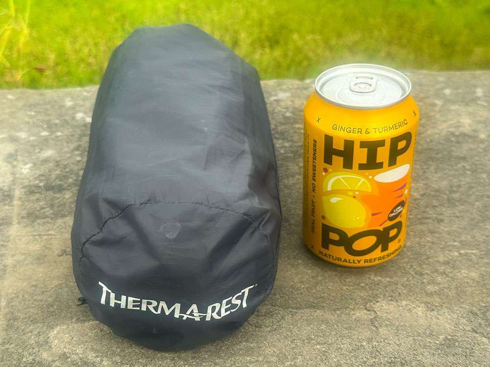 Comparison of the size of a rolled-up Therm-a-Rest Air Mat compared to a 330 ml can
