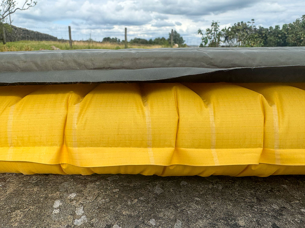 Even though the air mat provides more thickness, because the self-inflating mat has foam within it to provide structure, the air mat packs down much smaller