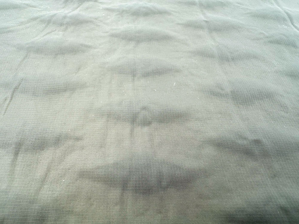 The textured flock top of an air bed - it stops you sliding around on it