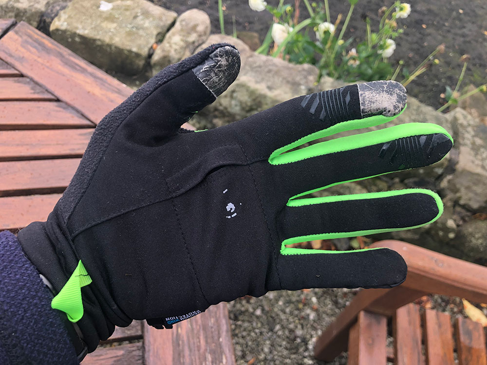 Lightweight glove with touchscreen conductive pads on finger and thumb