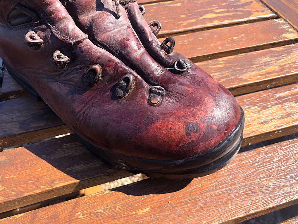 Water soaked into leather on hiking boot - no longer beading