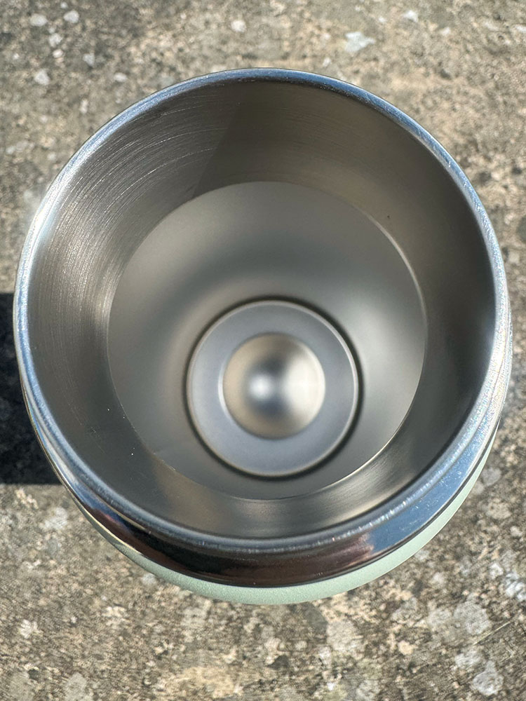 The wide opening of an insulated metal water bottle that is easy to fill