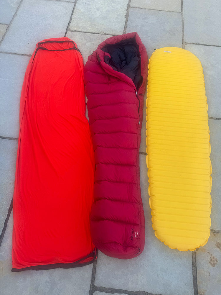 The complete sleep system - a sleeping mat, a sleeping bag and a sleeping bag liner