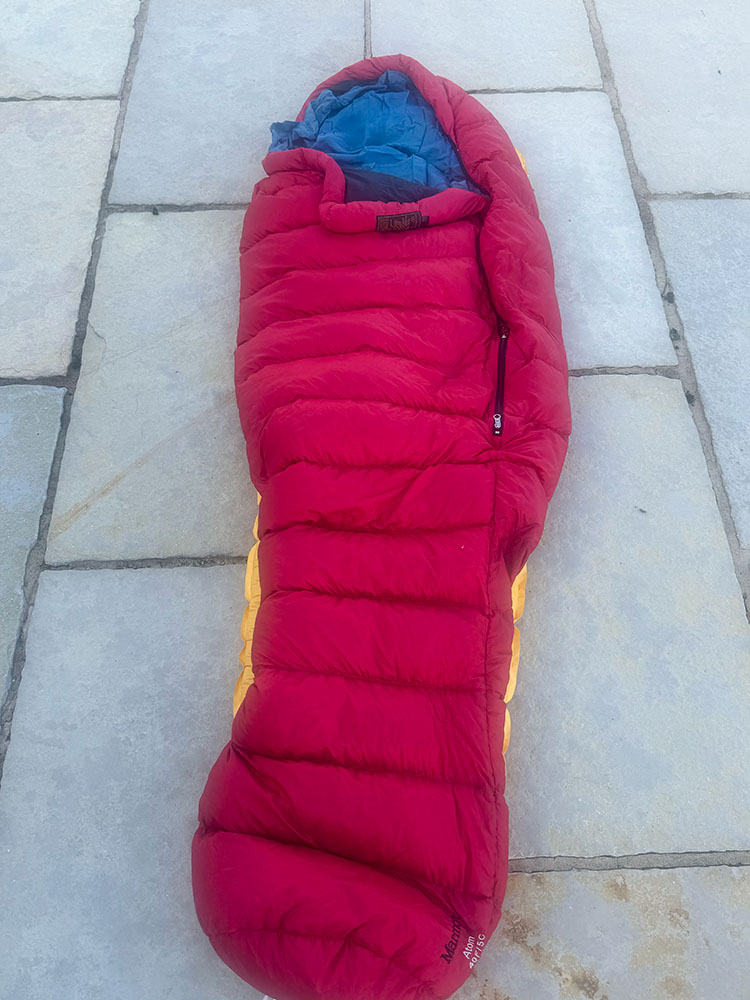 A silk mummy liner inside a sleeping bag, on top of a sleeping mat
