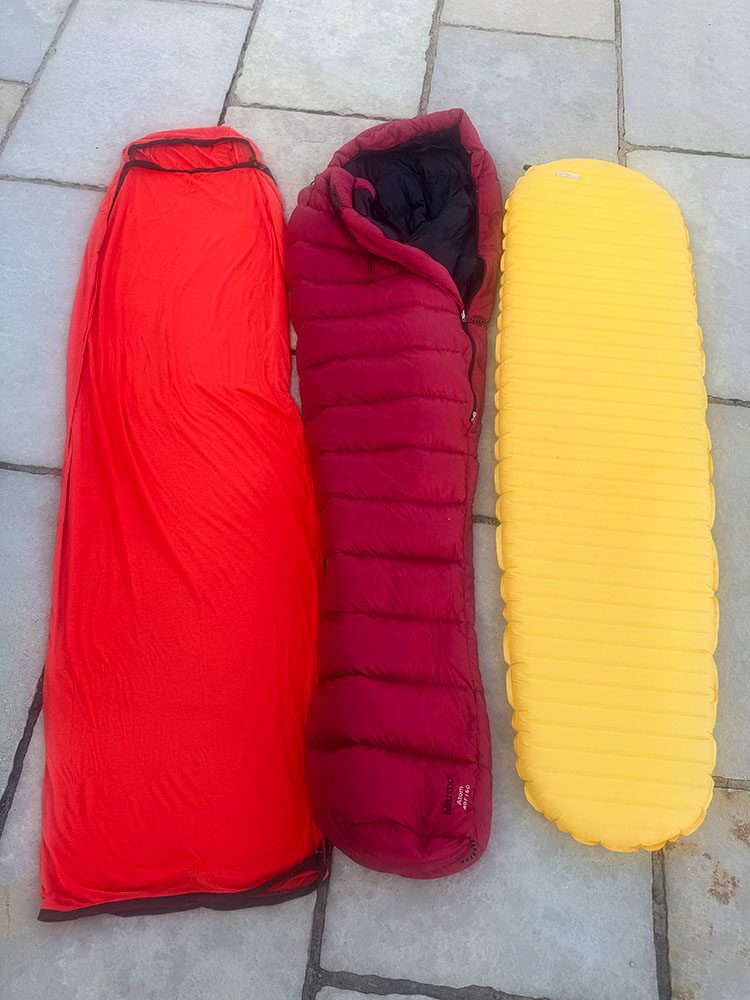 Sleep system for backpacking or camping - A sleeping bag liner, a sleeping bag and a sleeping mat