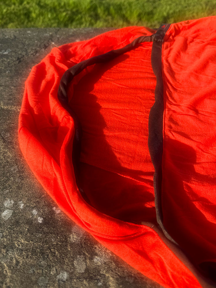 The hood on a thermal sleeping bag liner