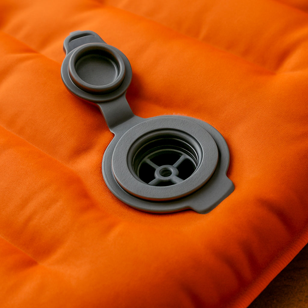 A close up of a valve on a sleeping mat
