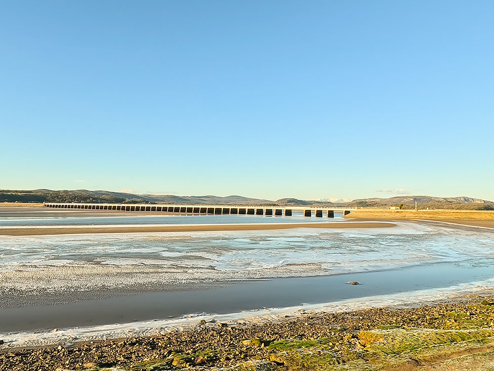 Arnside Viaduct from the promenade across the frozen sandbanks