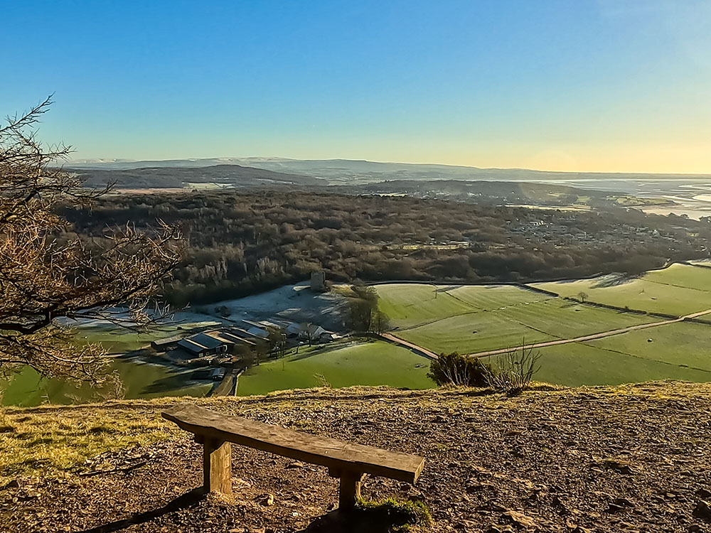 Looking down towards Arnside Tower from a bench on the south side of Arnside Knott