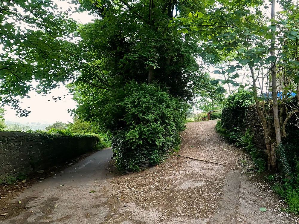 Gravel track heading right off the road