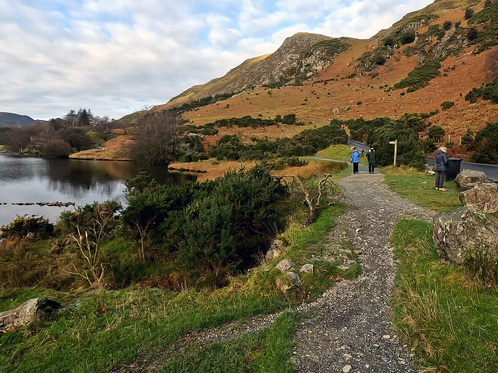 Where the path leaves the road to rejoin the lake