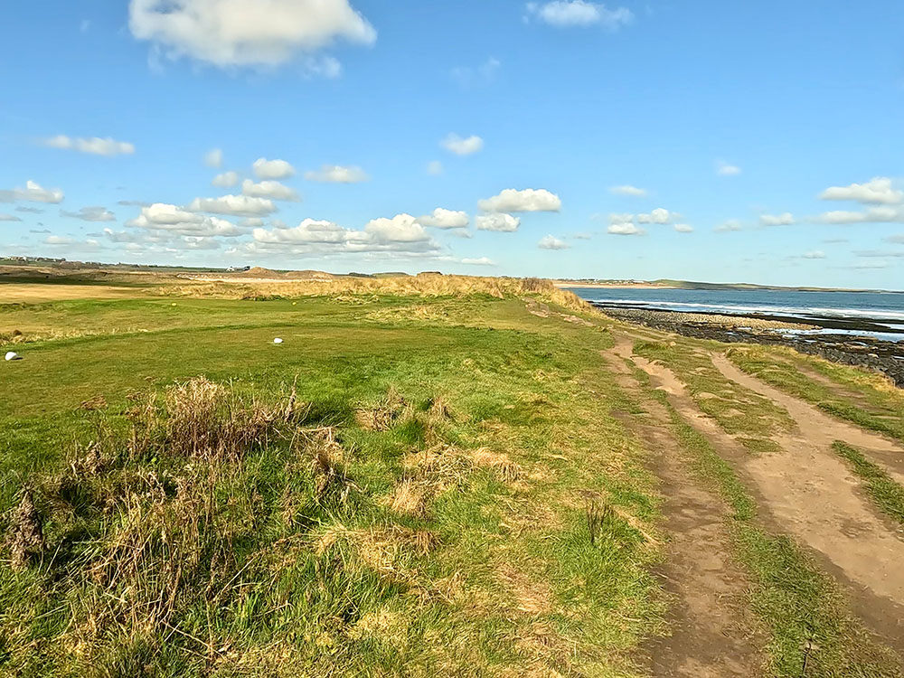 Footpath between Dunstanburgh golf course and the rocky beach