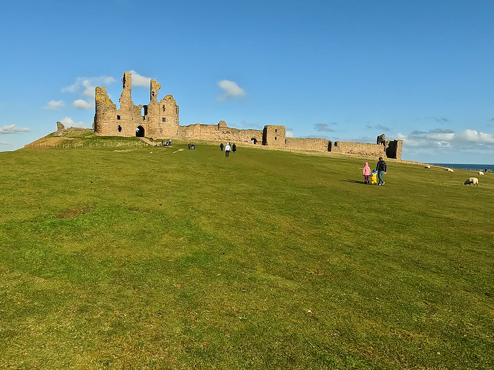 Grassy bank heading up to Dunstanburgh Castle