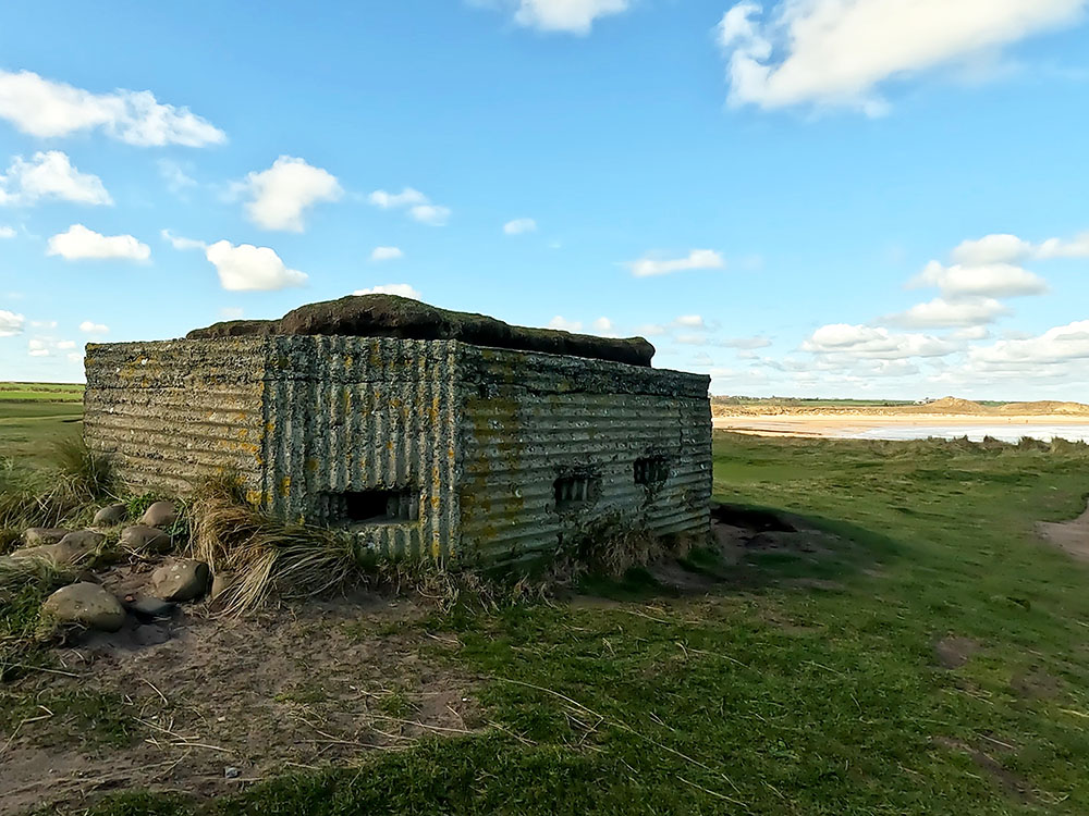 Hexagonal pillbox next to the footpath by Dunstanburgh golf course