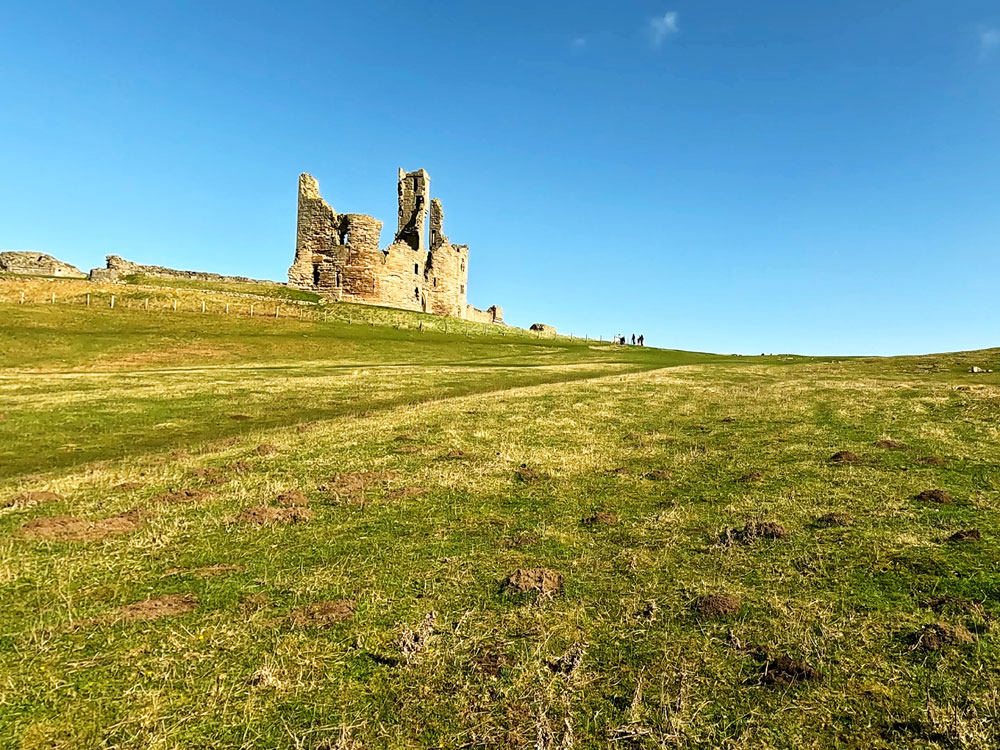 Looking up at Dunstanburgh Castle