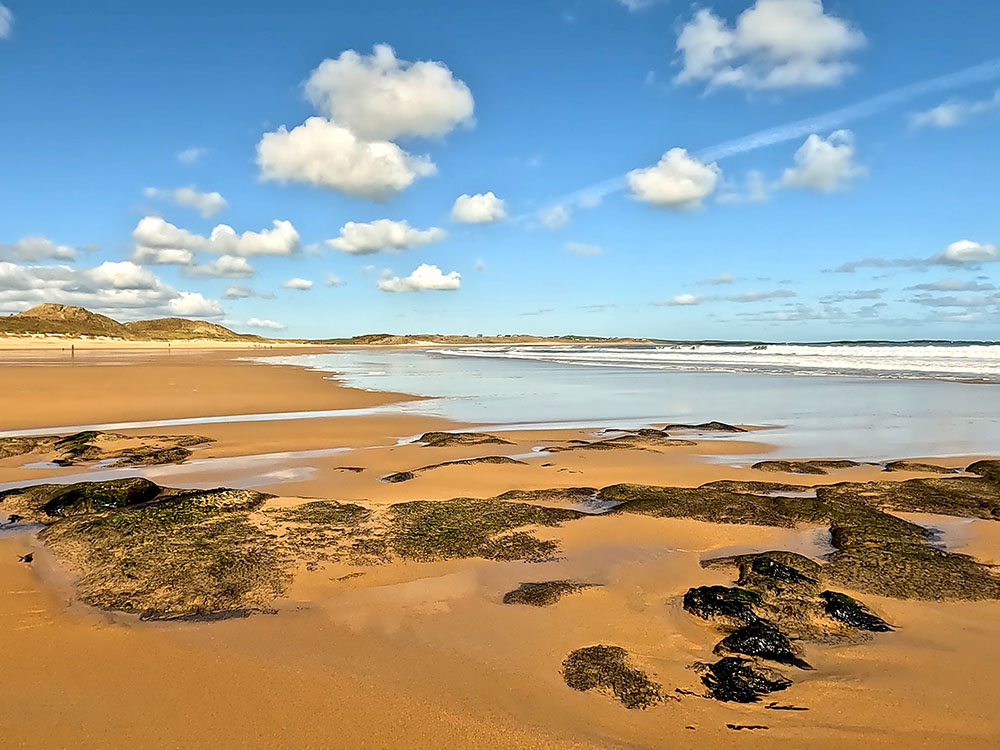 Seaweed and rocks on the beach at Embleton Bay