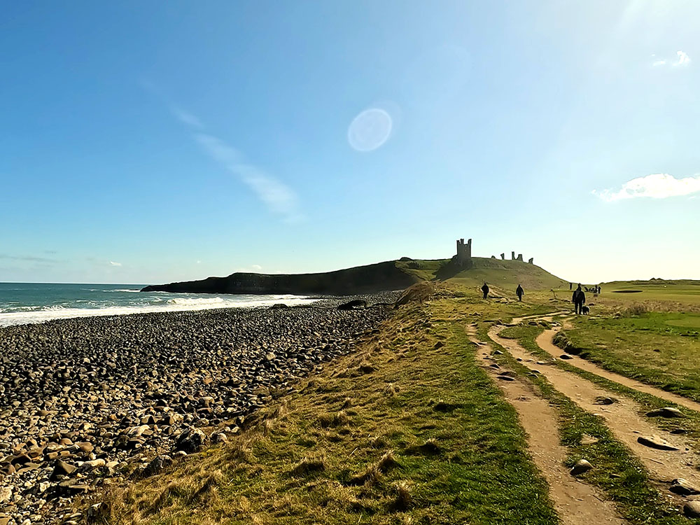 The rocky beach as Dunstanburgh Castle is approached