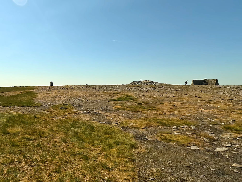Approaching the weather shelter and trig point on Ingleborough