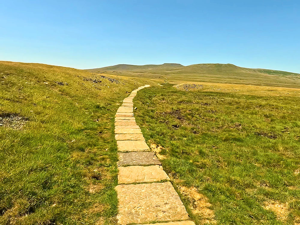 The flagged path through Sulber Nick heading towards Ingleborough