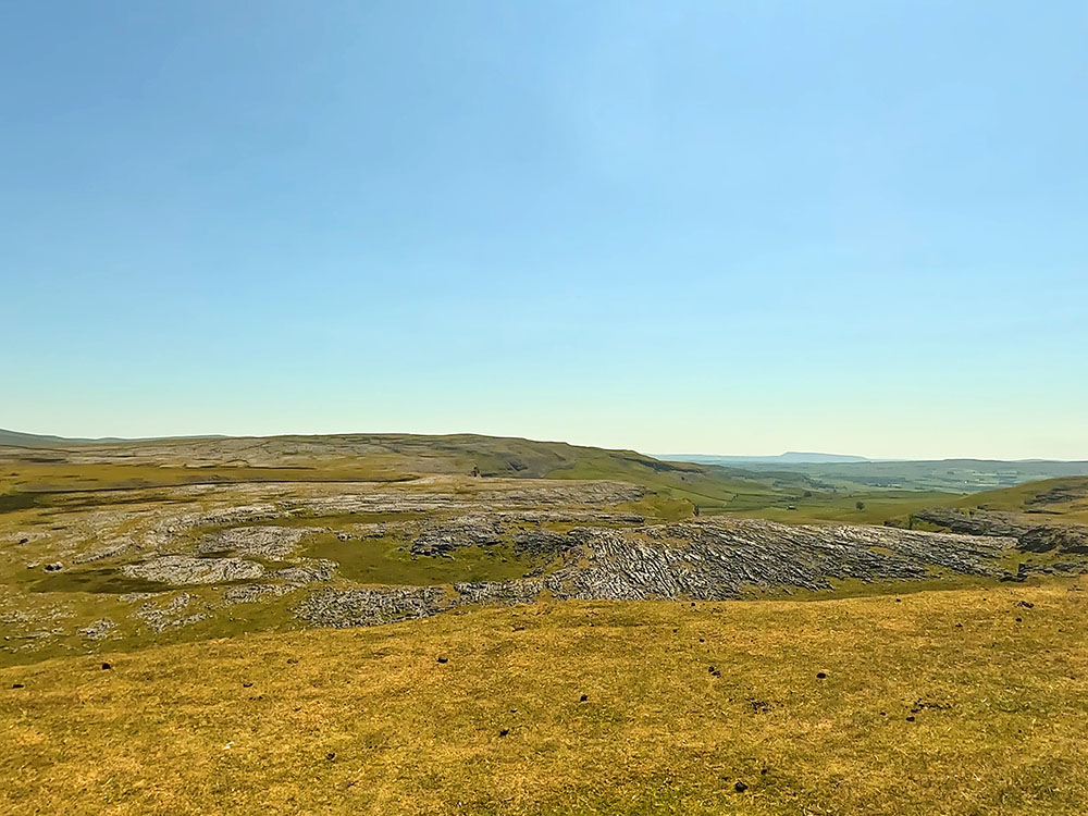 Looking over Thieves Moss and Moughton Scars with Pendle Hill on the horizon from Sulber Gate