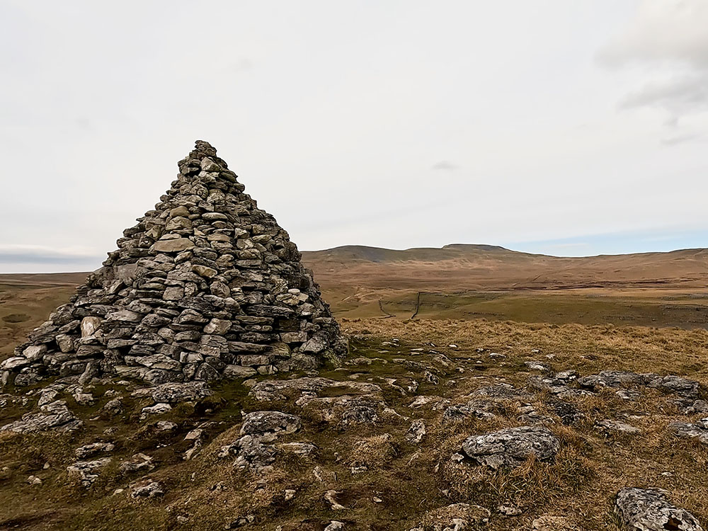 Ingleborough, Little Ingleborough and Simon Fell over the cairn