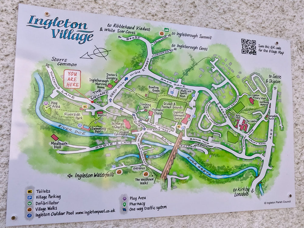 Ingleton Village sign at the junction of The Square and Thacking Lane