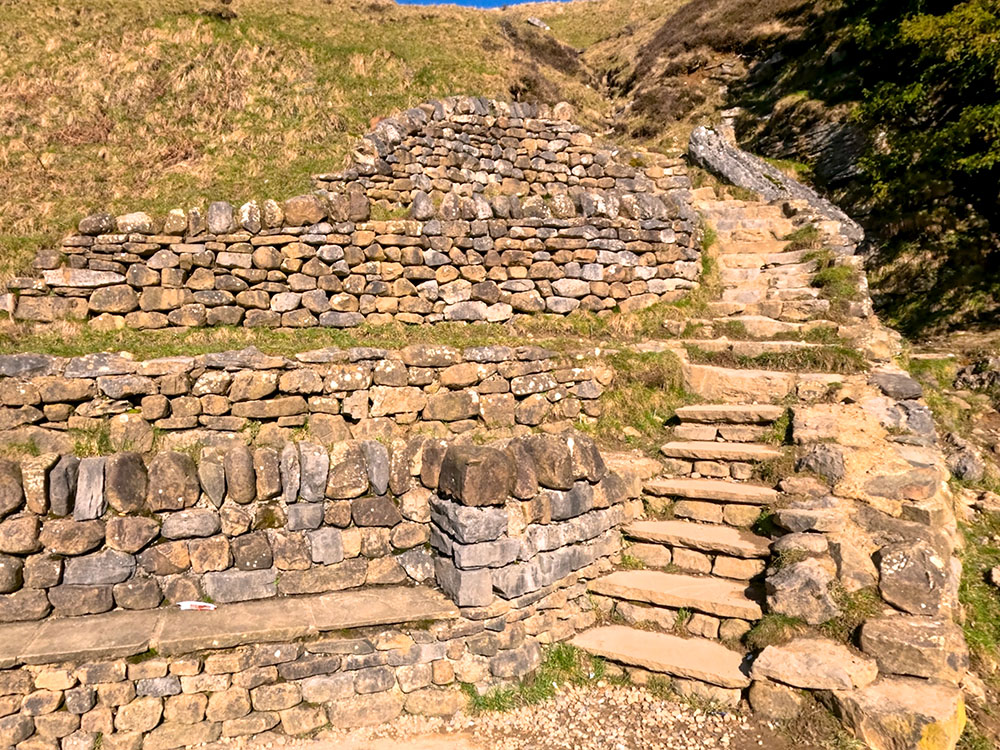 Seating and steps heading up over Thornton Force