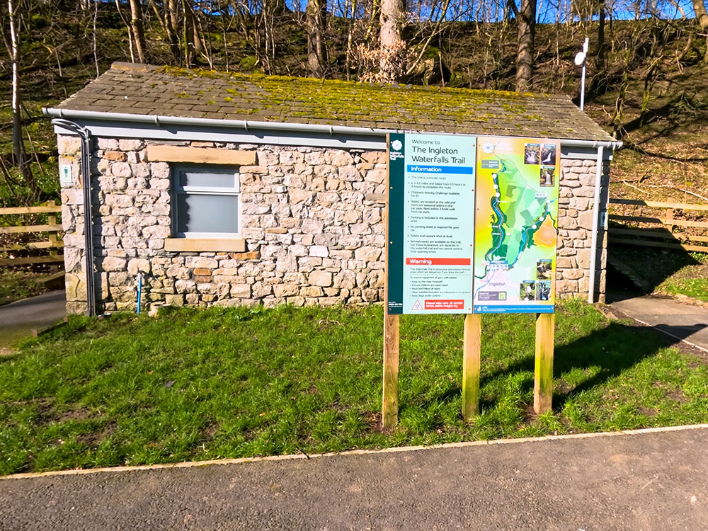 Toilets and information board in Broadwood car park at the start of the Ingleton Waterfalls walk