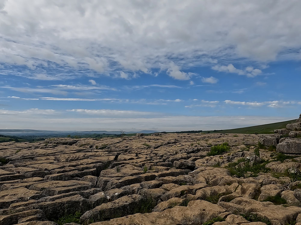 Heading across the limestone pavement above Malham Cove