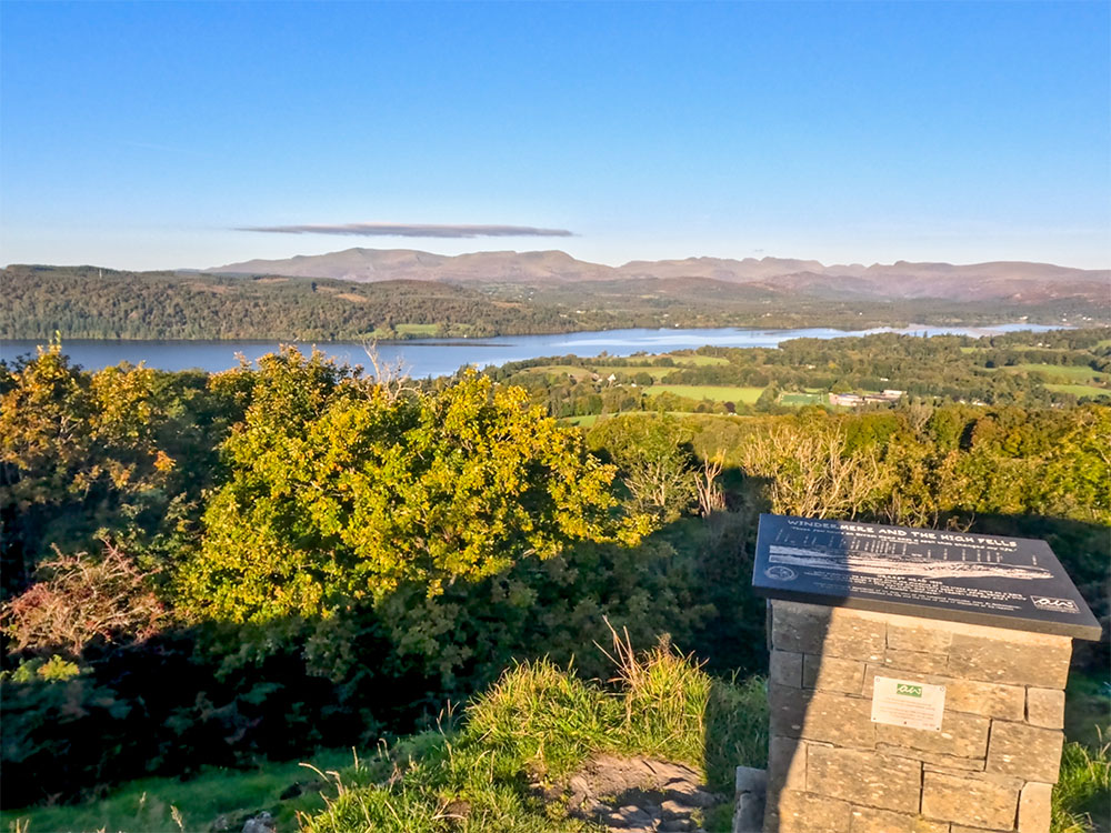 Looking west to north-west over the Wainwright plaque towards Wetherlam, Crinkle Crags, Scafell Pike, Bowfell and others