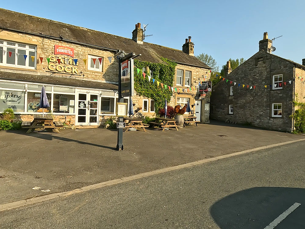 Road past the Game Cock Inn in Austwick