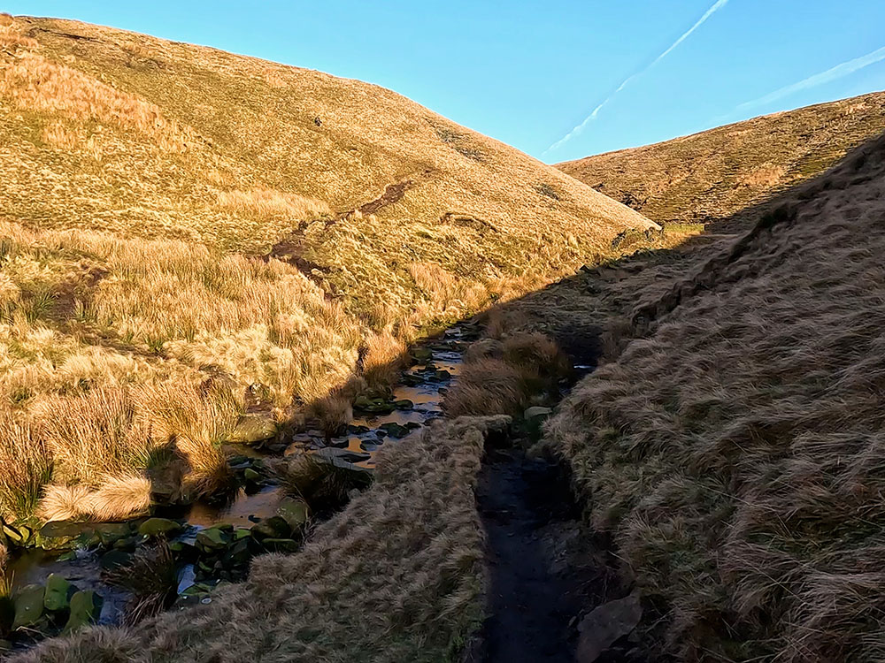 Crossing over the stream in Ogden Clough